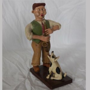 14-23785, Carved wood figure of a man playing the saxophone and dog, Berks/Lancaster co PA, 20th century. $1,295