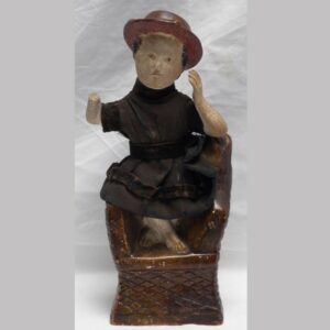 31-22653, Chalk figure of a seated boy in fabric dress, some loss. $750