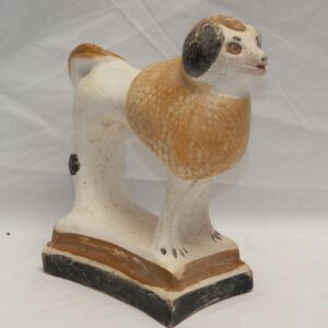 28-18981, Chalk standing poodle on base yellow and browns, black trim. $695