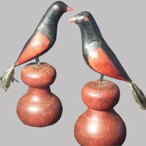 31-22529, Pair of folk art carved wood birds on later plinths, polychrome paint, real tail feathers, PA late 19th century. $2,250