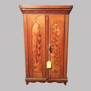 23-9122, Miniature paint decorated 2 door cupboard, cathedral panel doors, red flame and grain paint, with blue interior. $2,250