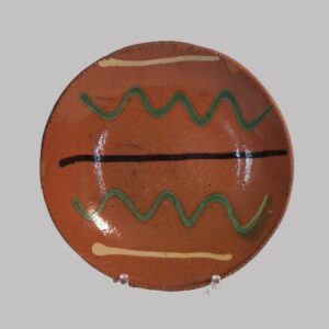 24-11188, 6 in. PA Redware pie plate 3 color slip decoration, probably Berks Co., line. $3,950