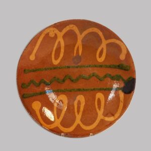 26-13946x, PA Redware plate, bold yellow and green slip decoration, hairline. $1,950